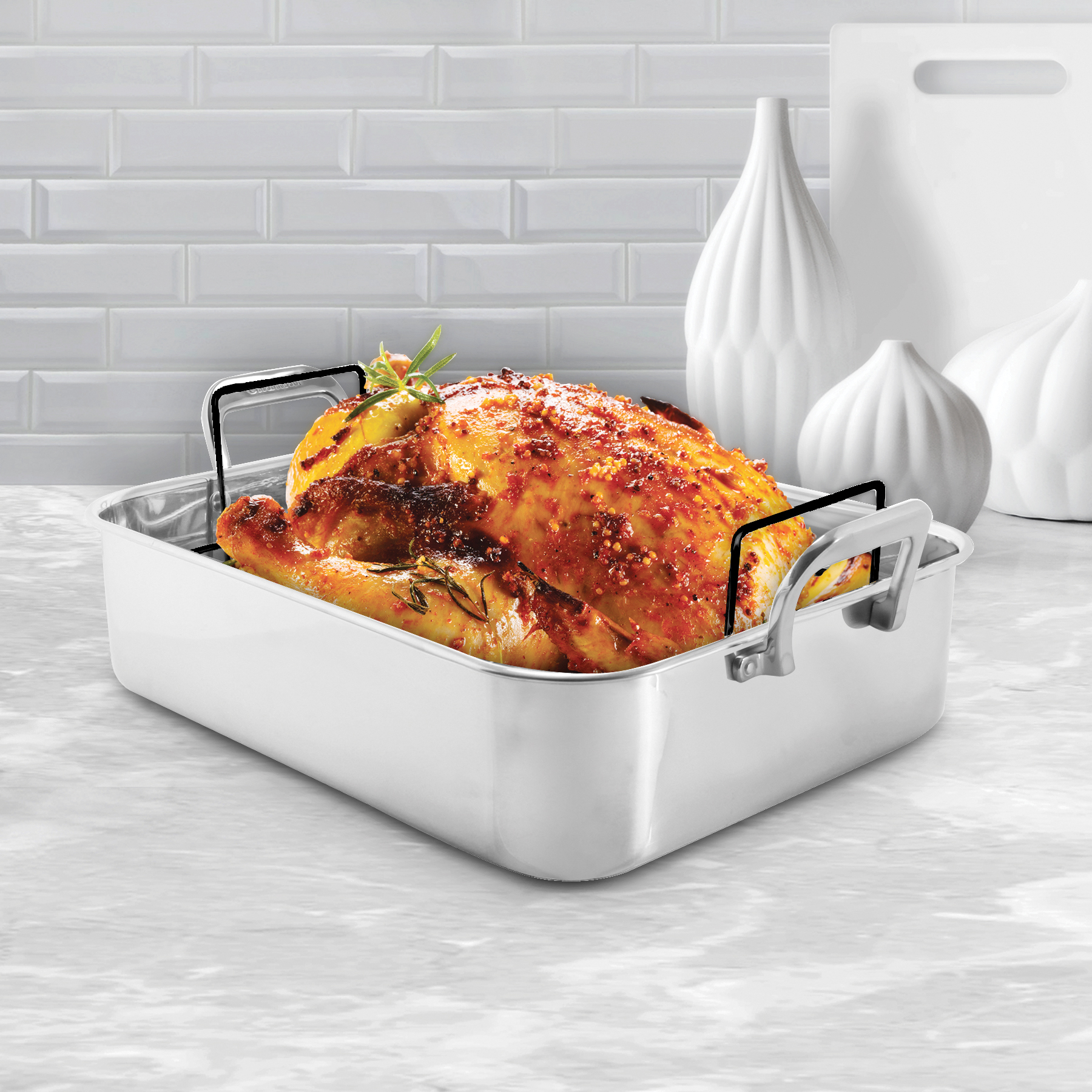 stainless steel roaster with rack and roasted turkey lifestyle